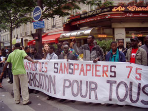 Organization of <i>sans-papiers</i> at a May 22, 2008 general strike march organized by the Confédération Générale du Travail (CGT). Banner calls for “regularization for all.” Photo credit: Marie Kennedy