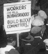 protest sign: Workers in all neighborhoods: Build Block Committees!
