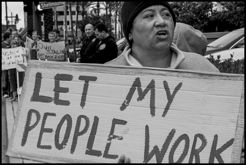 Immigrant Latino workers from the Woodfin Suites hotel in Emeryville, Calif., and their supporters protest after hotel managers fired 20 workers, accusing them of lacking legal immigration status.