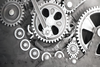 Charlie Chaplin’s character the Tramp gets caught in the gears of the factory where he works in Chaplin’s 1936 film “Modern Times.” Credit: Modern Times © Roy Export SAS.